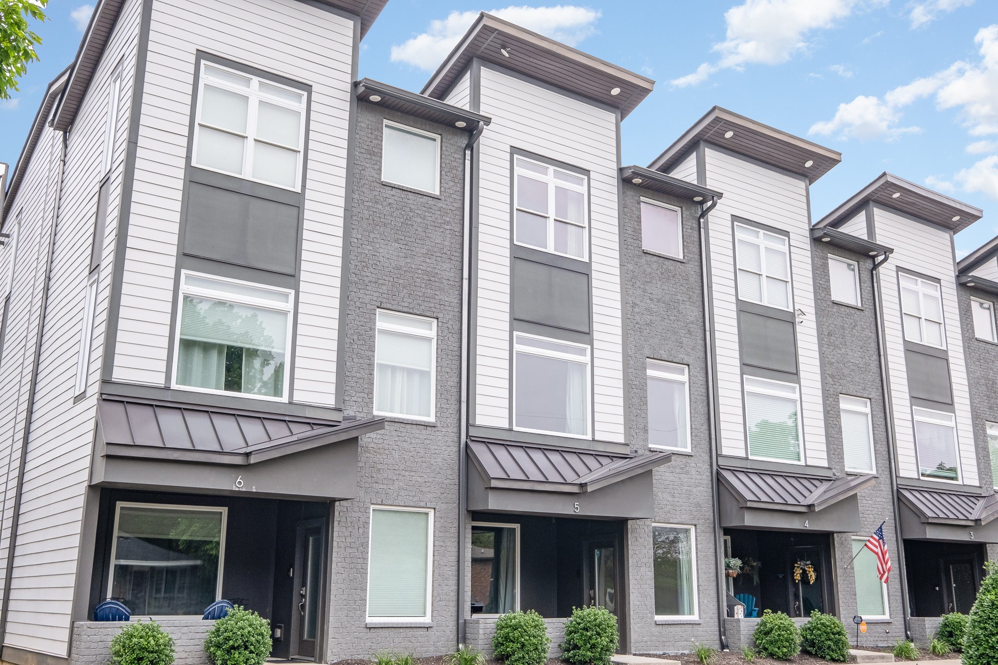 1106 Wade Avenue, Unit 5 Nashville, TN 37203 - Photo 1 of 33 a front view of a brick building with a lot of windows