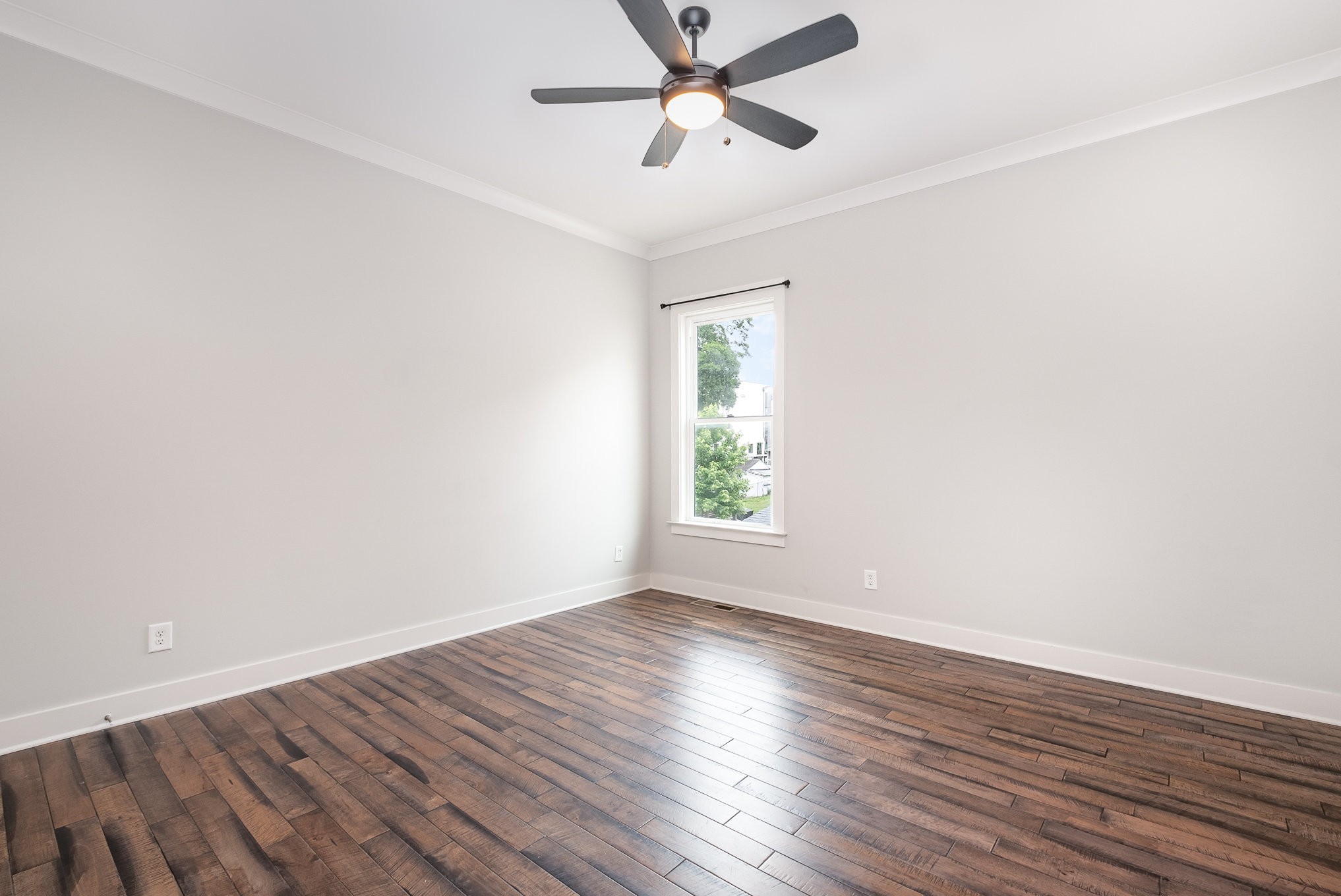1106 Wade Avenue, Unit 5 Nashville, TN 37203 - Photo 14 of 33 an empty room with wooden floor and windows