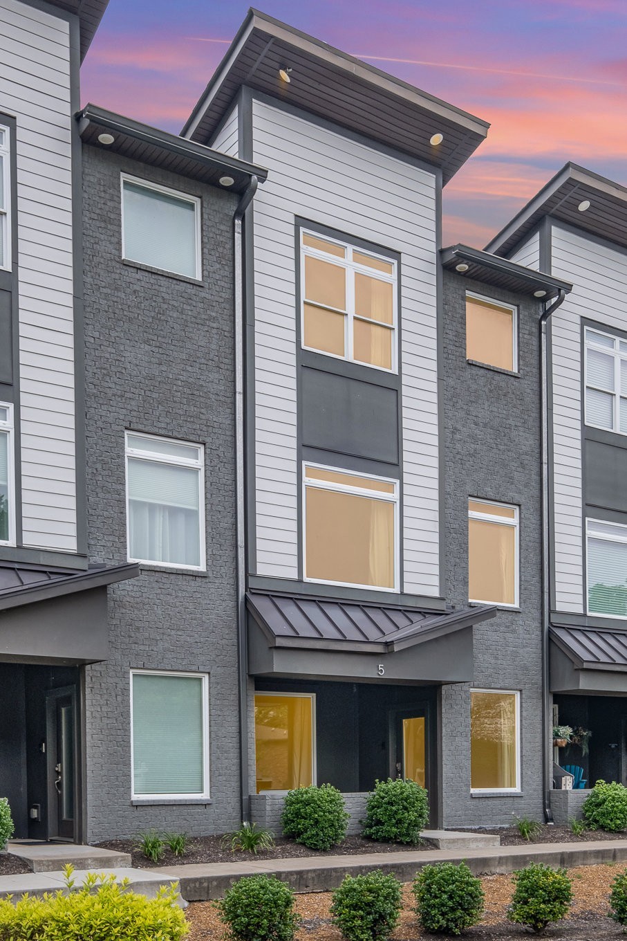 1106 Wade Avenue, Unit 5 Nashville, TN 37203 - Photo 27 of 33 a view of building with a lot of windows and plants