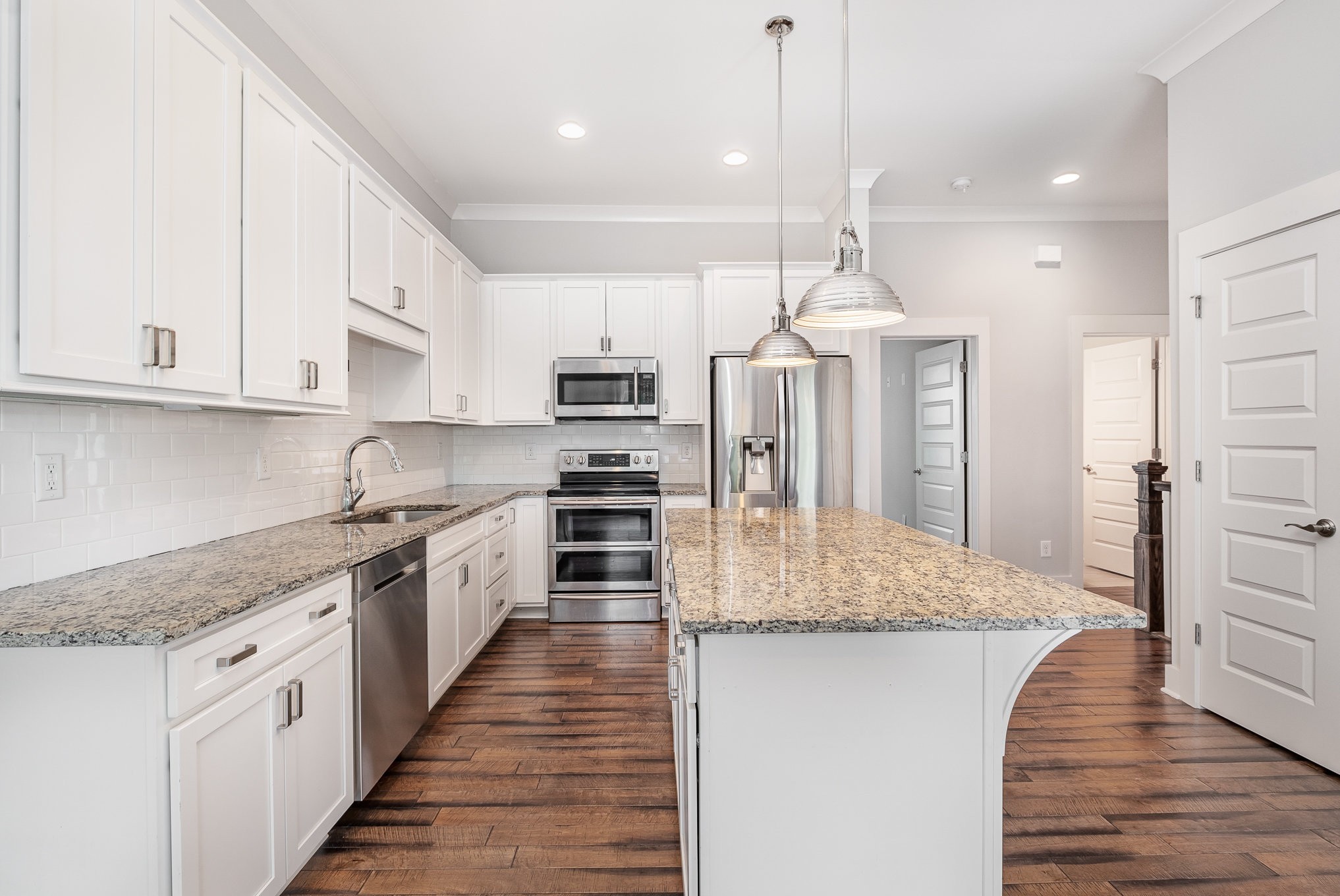 1106 Wade Avenue, Unit 5 Nashville, TN 37203 - Photo 6 of 33 a kitchen with stainless steel appliances granite countertop a sink a stove and a refrigerator