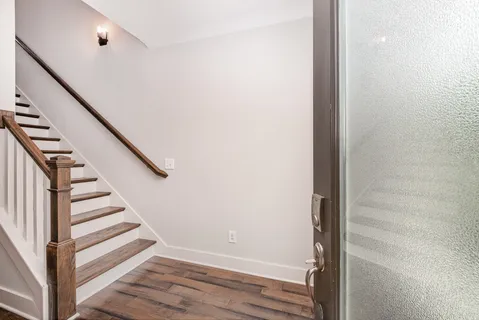 a view of entryway with wooden floor
