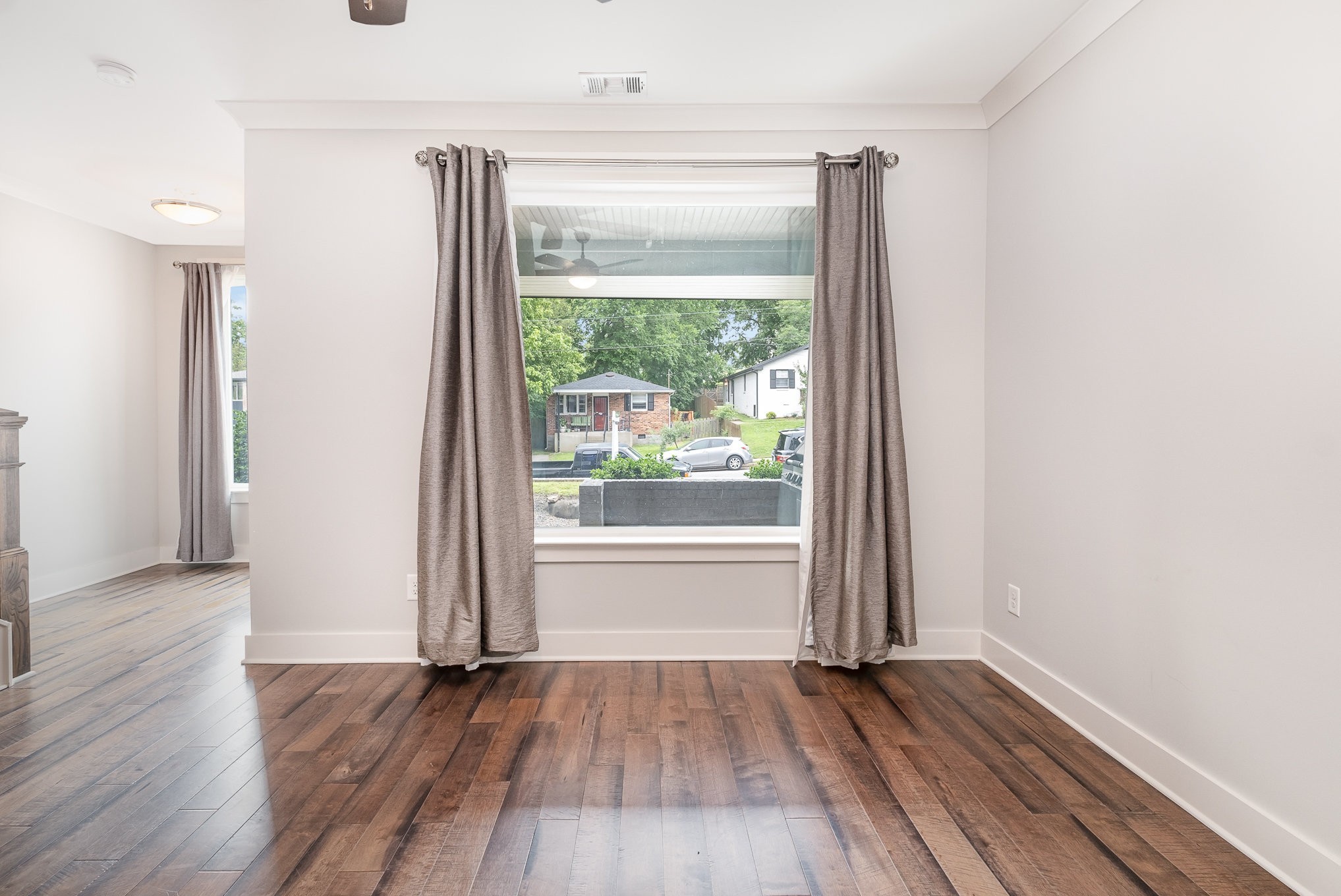 1106 Wade Avenue, Unit 5 Nashville, TN 37203 - Photo 8 of 33 an empty room with wooden floor and a window