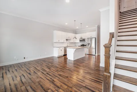 a view of kitchen with wooden floor