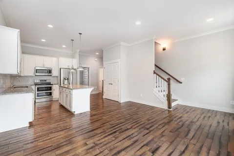 a view of kitchen with cabinets and wooden floor