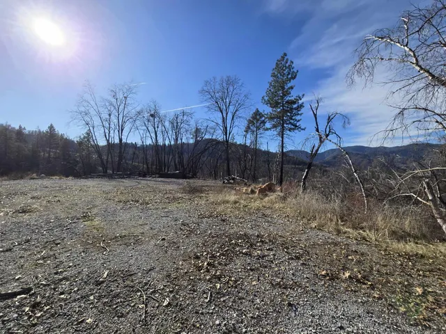 a view of a backyard of the house