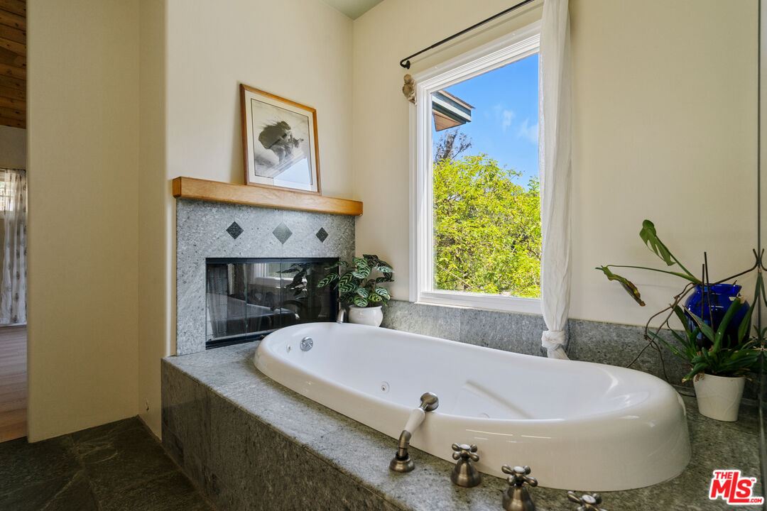 20912 Fontaine Road Topanga, CA 90290 - Photo 23 of 52 a bath tub sitting in a bathroom next to a window