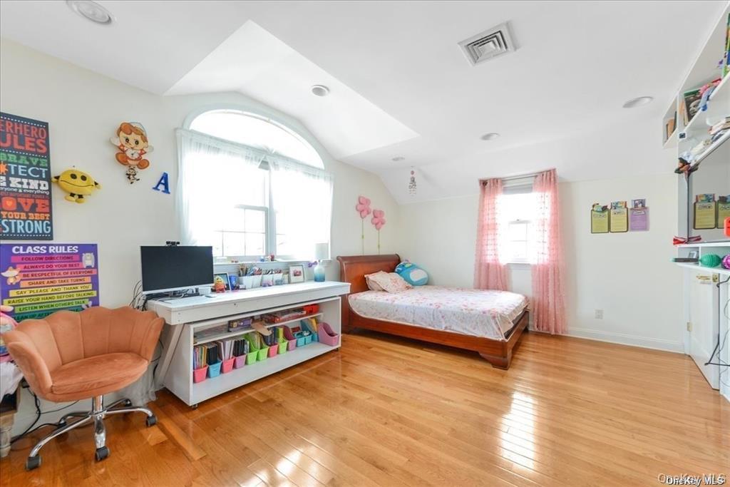 99-78 164th Road Queens, NY 11414 - Photo 11 of 20 a room with furniture and a flat screen tv