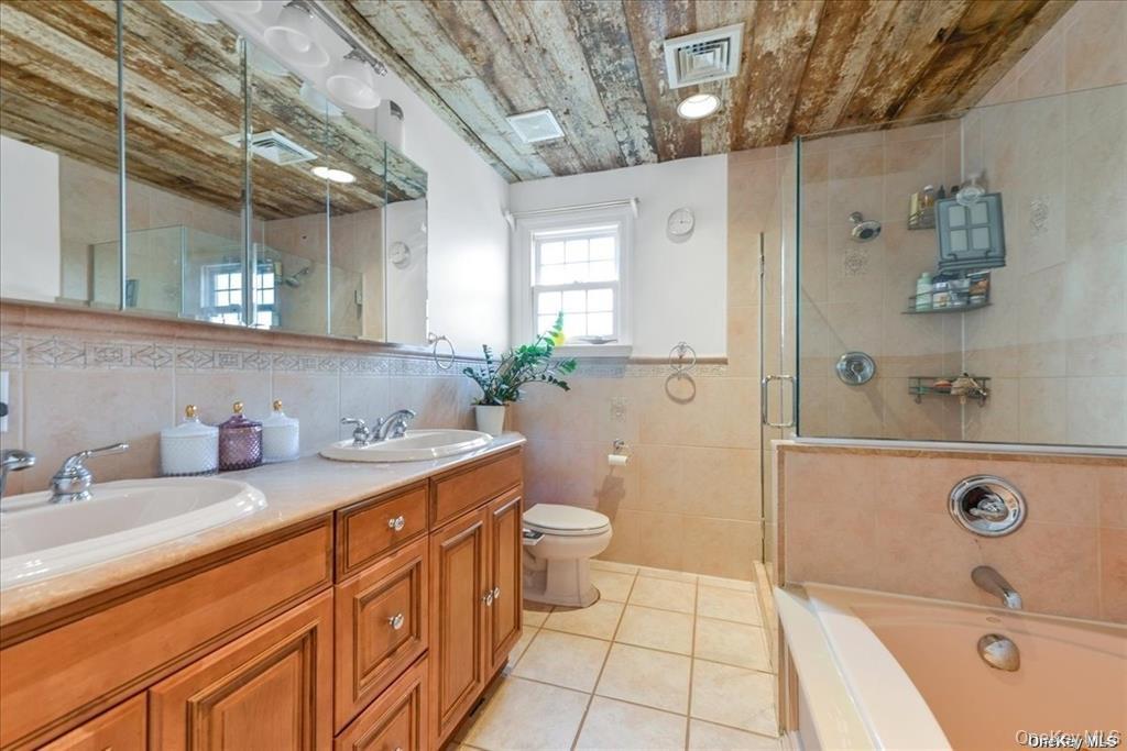 99-78 164th Road Queens, NY 11414 - Photo 13 of 20 a bath room with a sink a toilet and a shower