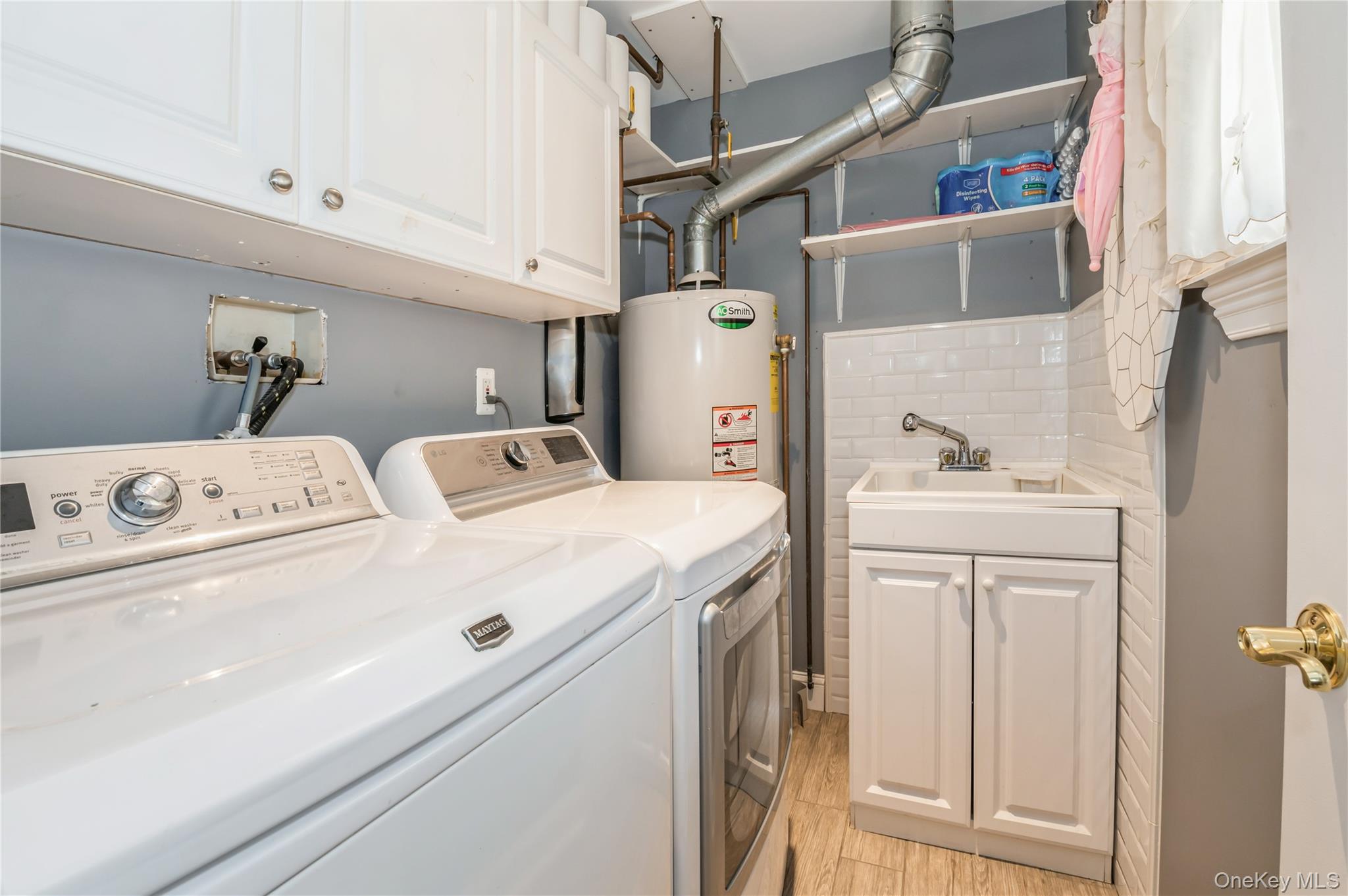 99-78 164th Road Queens, NY 11414 - Photo 17 of 20 a utility room with dryer and washer