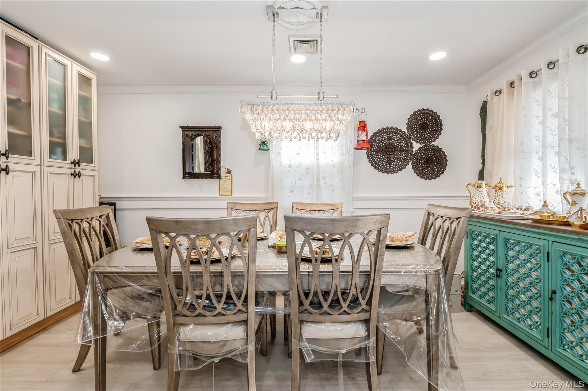 99-78 164th Road Queens, NY 11414 - Photo 8 of 20 a view of a dining room with furniture and chandelier