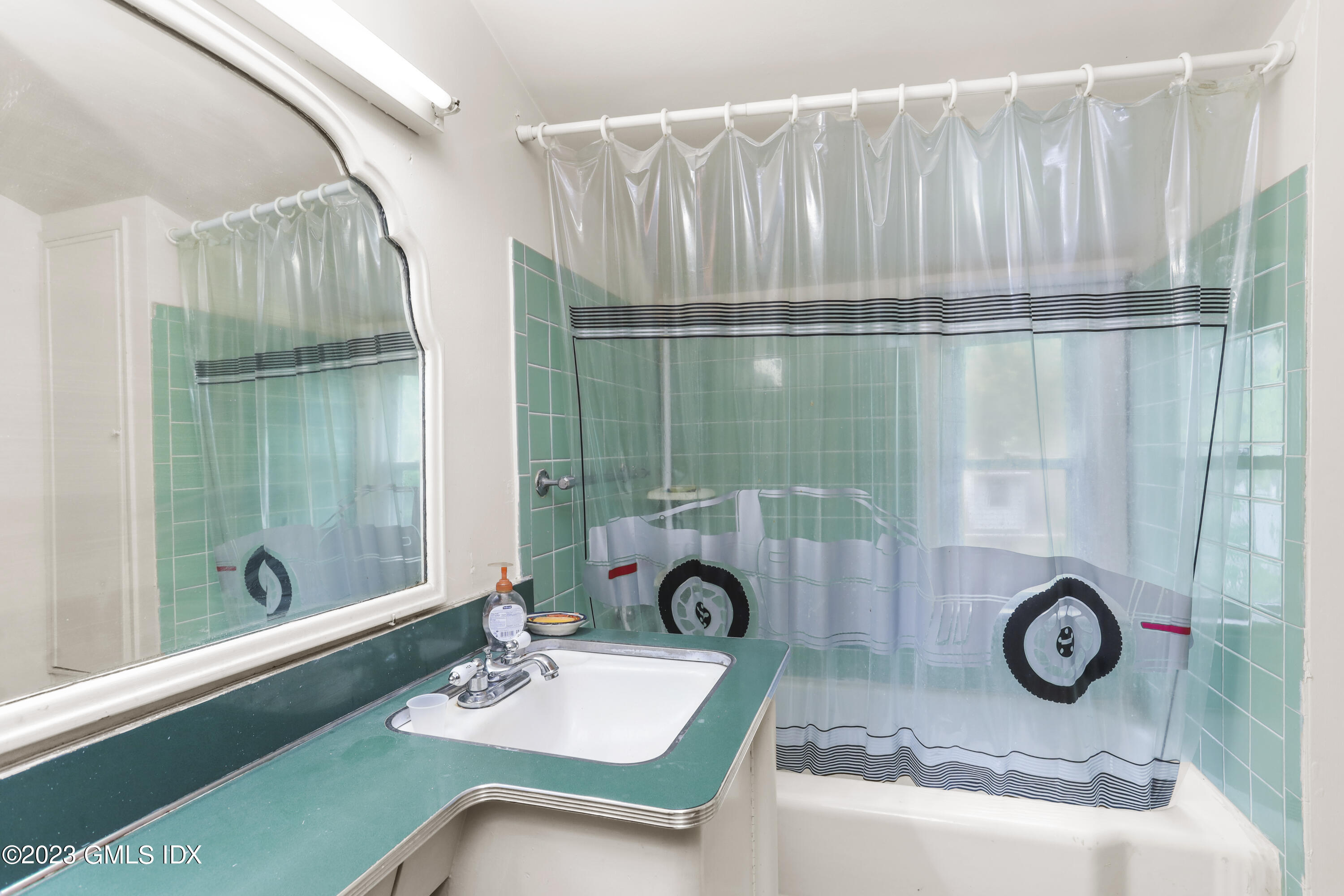 16 Hoover Road Riverside, CT 06878 - Photo 16 of 32 a bathroom with a sink and mirror
