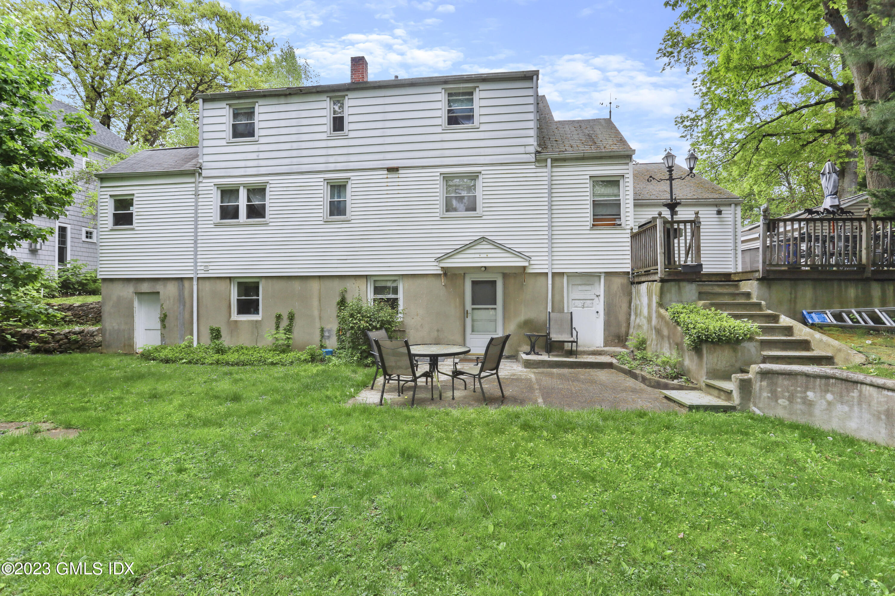 16 Hoover Road Riverside, CT 06878 - Photo 24 of 32 a view of a house with a yard and sitting area