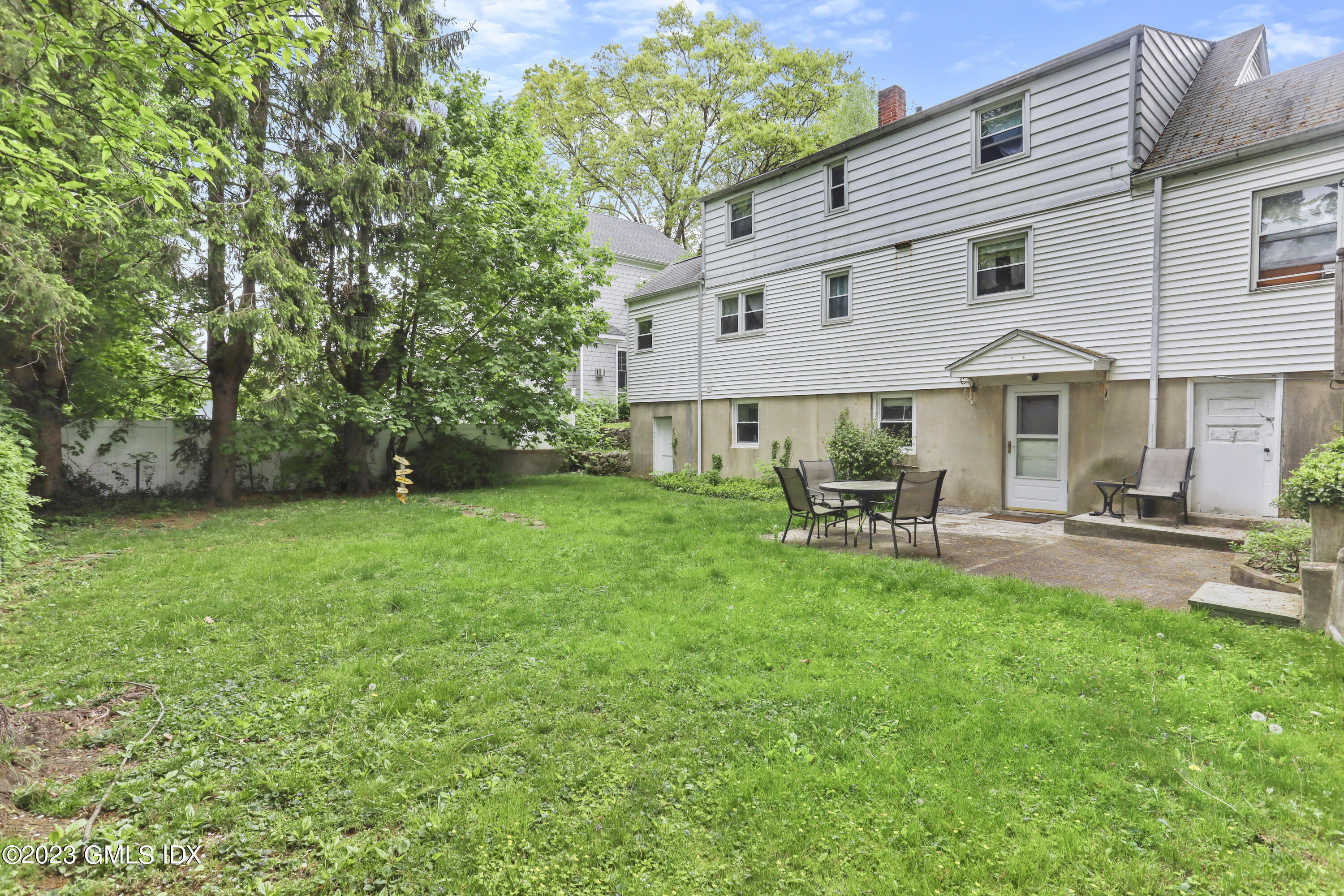 16 Hoover Road Riverside, CT 06878 - Photo 26 of 32 a front view of a house with patio and garden