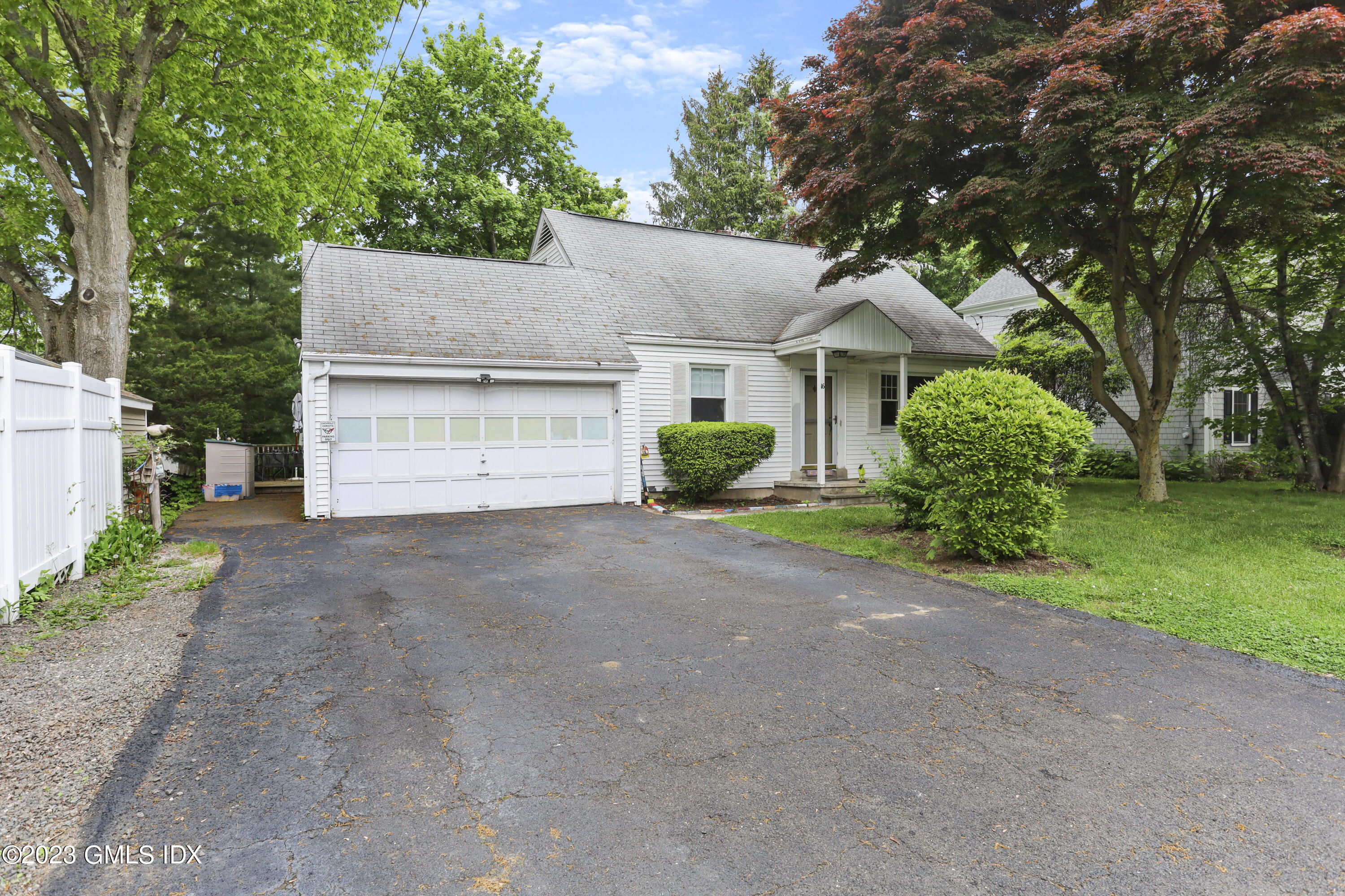 16 Hoover Road Riverside, CT 06878 - Photo 3 of 32 a view of a house with a yard and garage