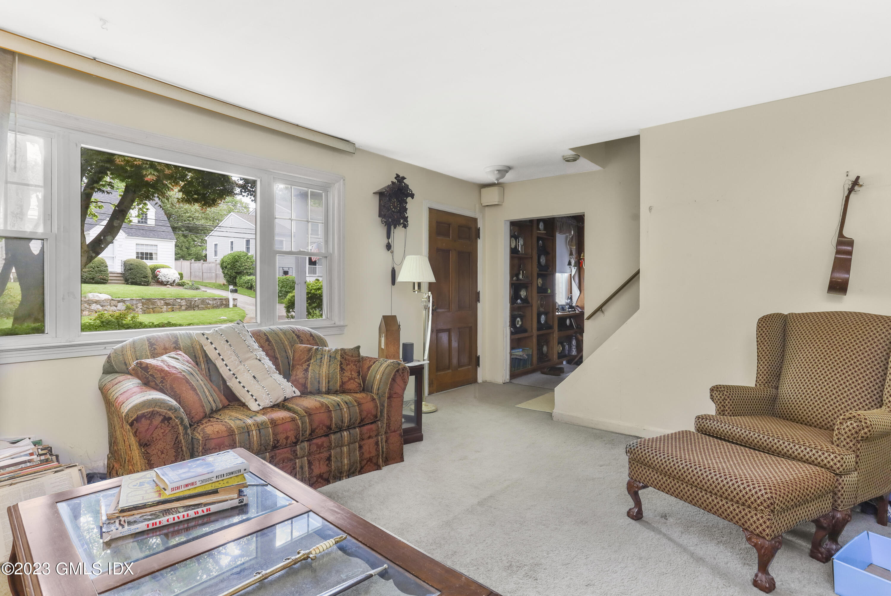 16 Hoover Road Riverside, CT 06878 - Photo 6 of 32 a living room with furniture and a large window