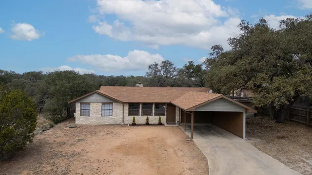 a aerial view of a house with yard