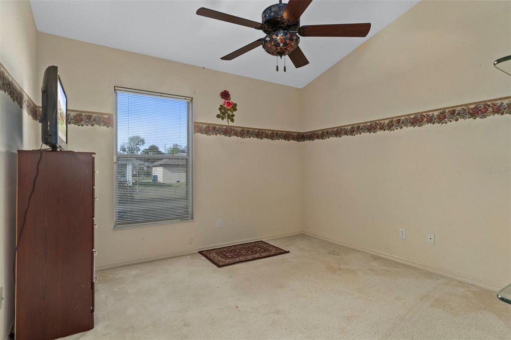 5465 Chestnut Ridge Road Dade City, FL 33523 - Photo 18 of 37 a view of an empty room with cabinet