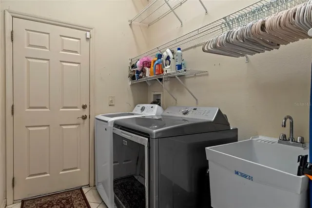 a utility room with dryer and washer
