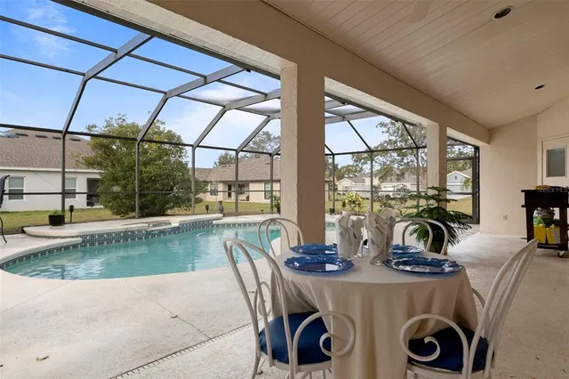 a view of a dining room with furniture water view and fountain