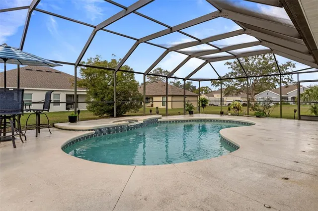 a view of a swimming pool with a patio