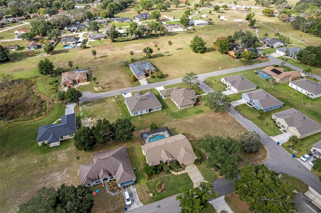 5465 Chestnut Ridge Road Dade City, FL 33523 - Photo 34 of 37 an aerial view of residential houses with outdoor space