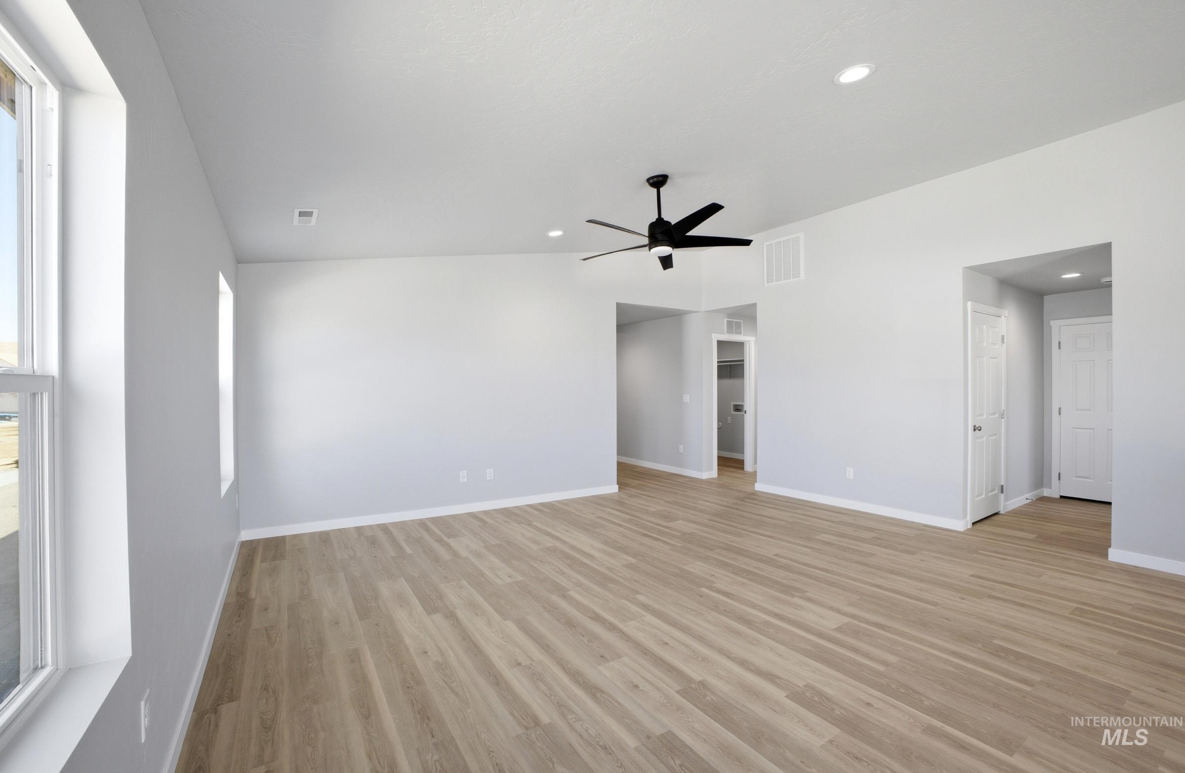 14106 Winding Street Caldwell, ID 83607 - Photo 7 of 18 Spacious interior featuring wood-finish flooring, light gray walls, and recessed lighting