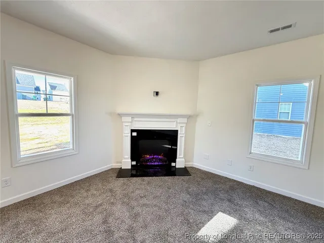 a large kitchen with a sink and stainless steel appliances