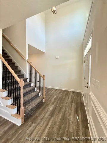 a view of entryway with wooden floor