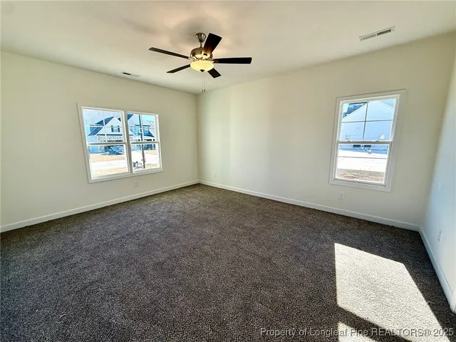 a view of a bathroom from a hallway
