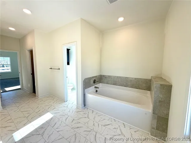 a view of a livingroom with wooden floor