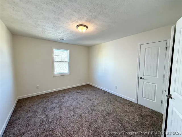 an empty room with a empty space and window