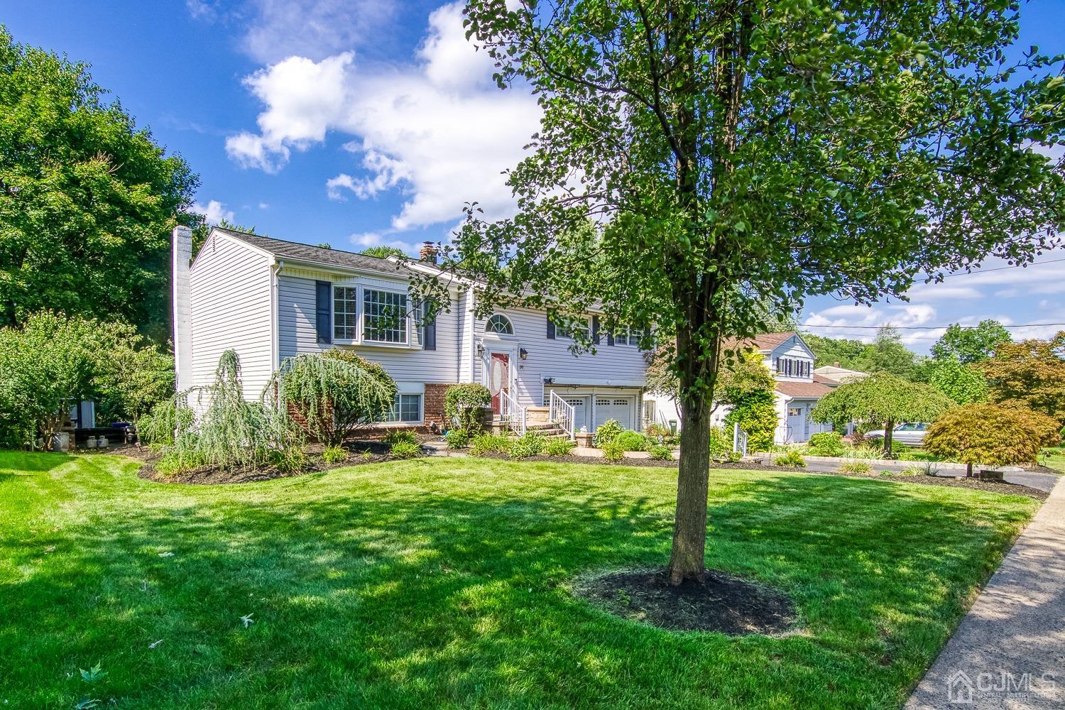 30 Kingsbridge Road Somerset, NJ 08873 - Photo 2 of 23 a view of a house with backyard and a tree