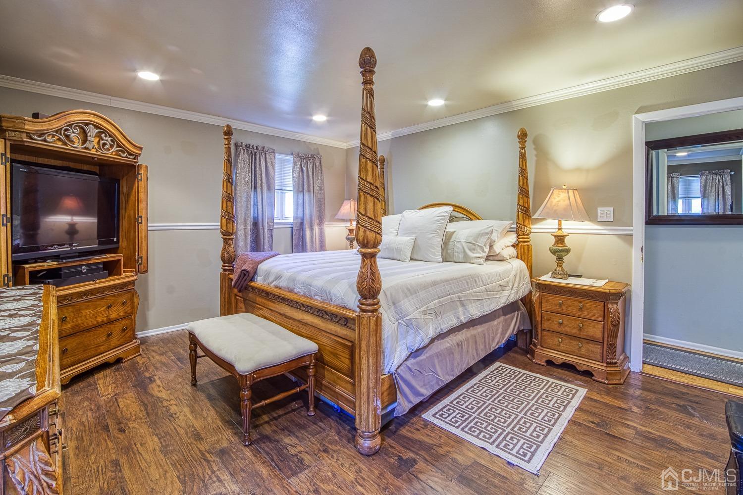 30 Kingsbridge Road Somerset, NJ 08873 - Photo 12 of 23 a bedroom with a bed and a flat screen tv
