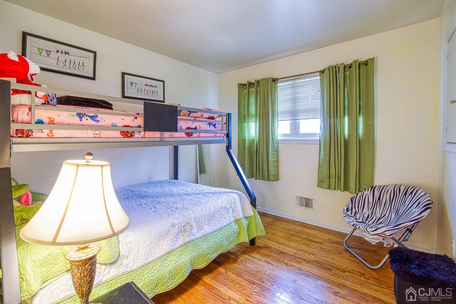 30 Kingsbridge Road Somerset, NJ 08873 - Photo 15 of 23 a bed room with a bed and a chair