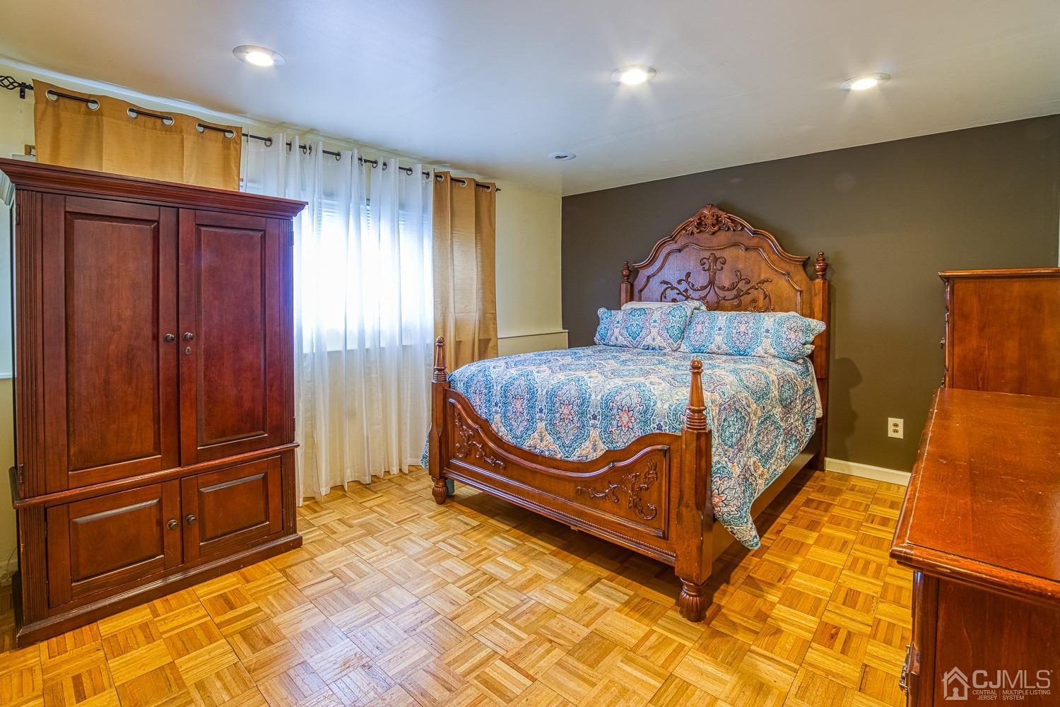 30 Kingsbridge Road Somerset, NJ 08873 - Photo 16 of 23 a bedroom with a bed and wooden floor