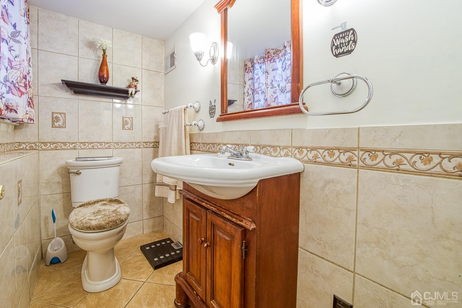 30 Kingsbridge Road Somerset, NJ 08873 - Photo 17 of 23 a bathroom with a sink and a toilet