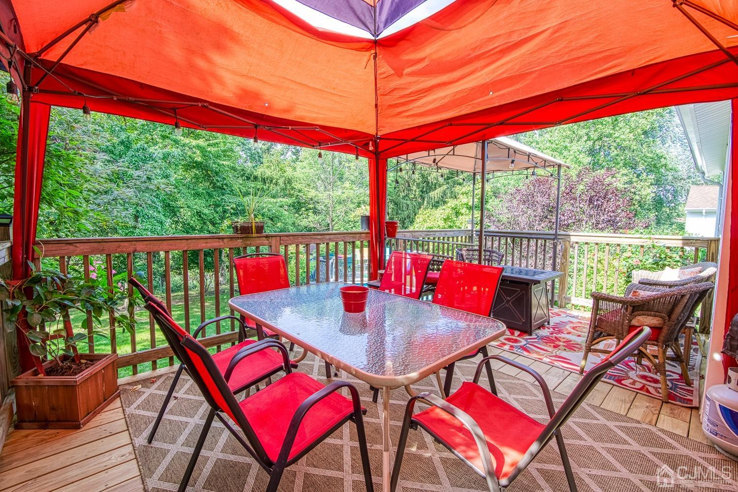 30 Kingsbridge Road Somerset, NJ 08873 - Photo 18 of 23 a view of a patio with a table chairs and a backyard