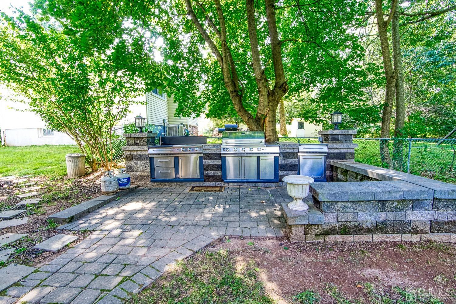 30 Kingsbridge Road Somerset, NJ 08873 - Photo 21 of 23 a view of a house with backyard and sitting area
