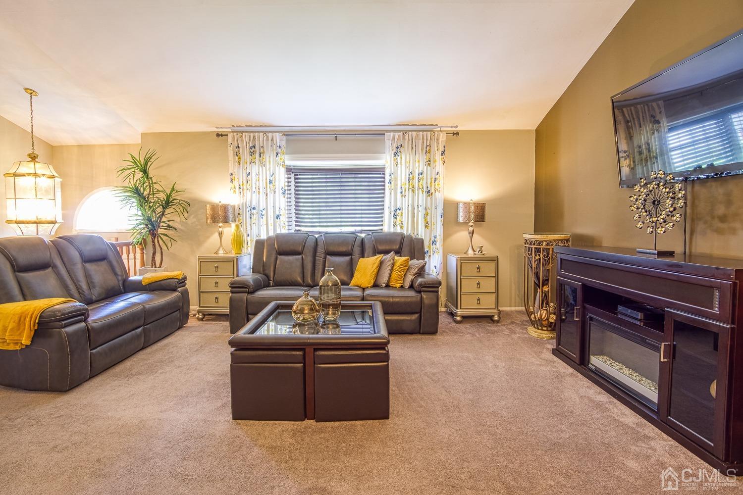 30 Kingsbridge Road Somerset, NJ 08873 - Photo 5 of 23 a living room with furniture a lamp and a fireplace