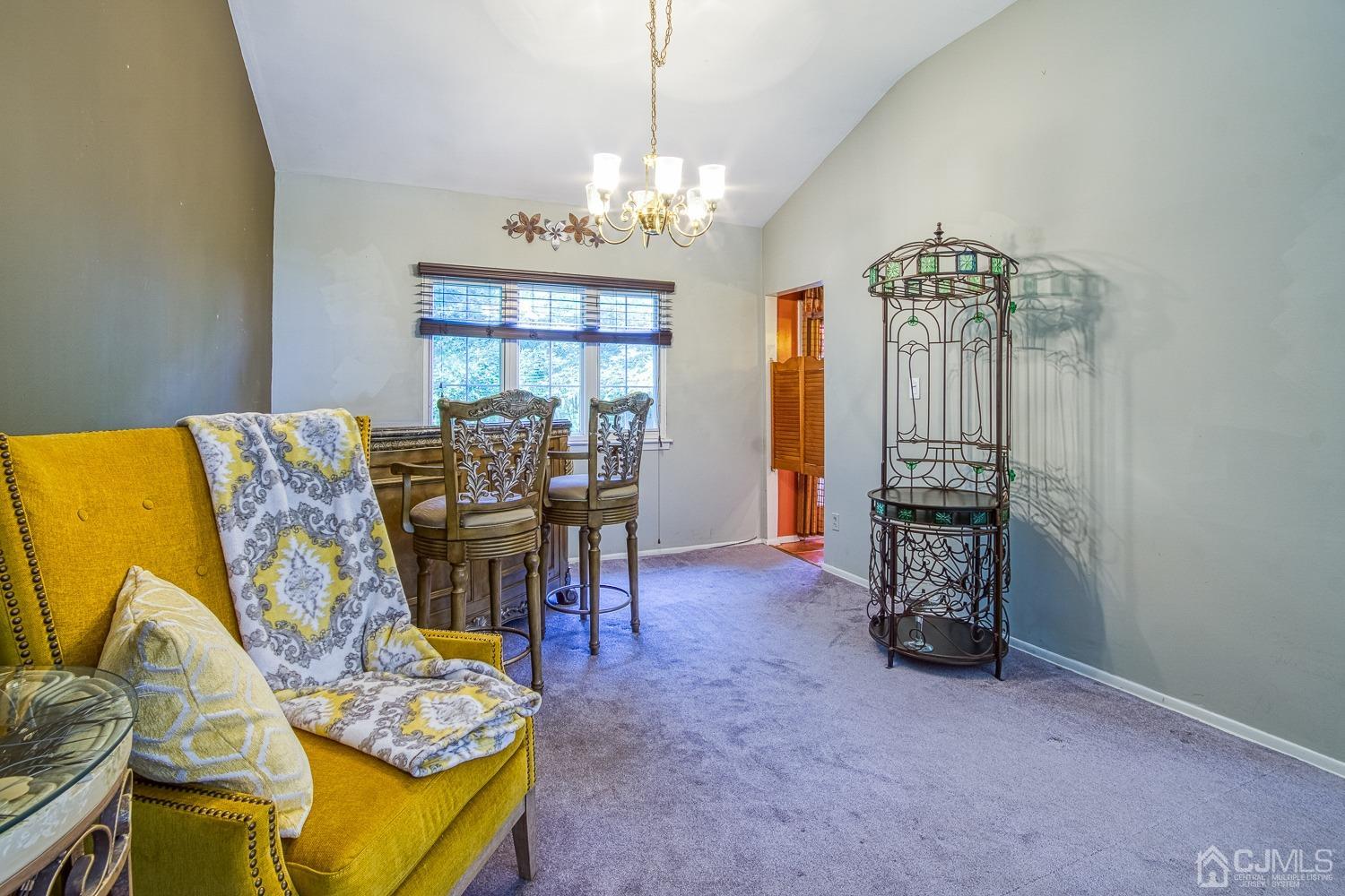 30 Kingsbridge Road Somerset, NJ 08873 - Photo 6 of 23 a view of a dining room with furniture and a chandelier