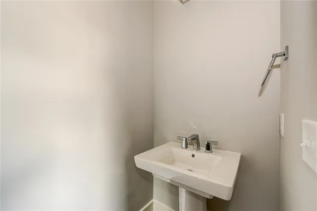 a white sink sitting next to a white sink