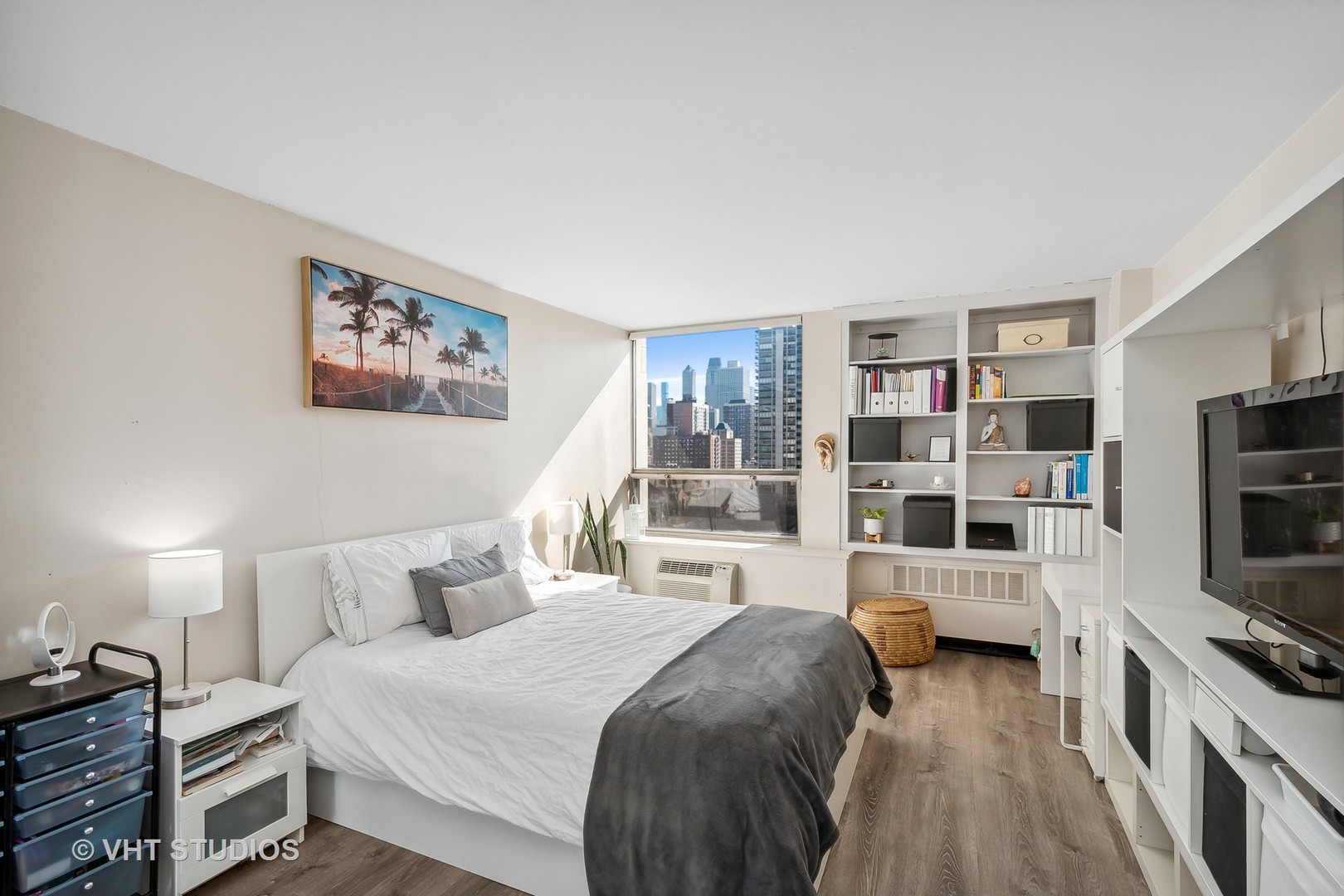 Undisclosed Address Chicago, IL 60610 - Photo 7 of 16 a bedroom with a bed and a flat screen tv