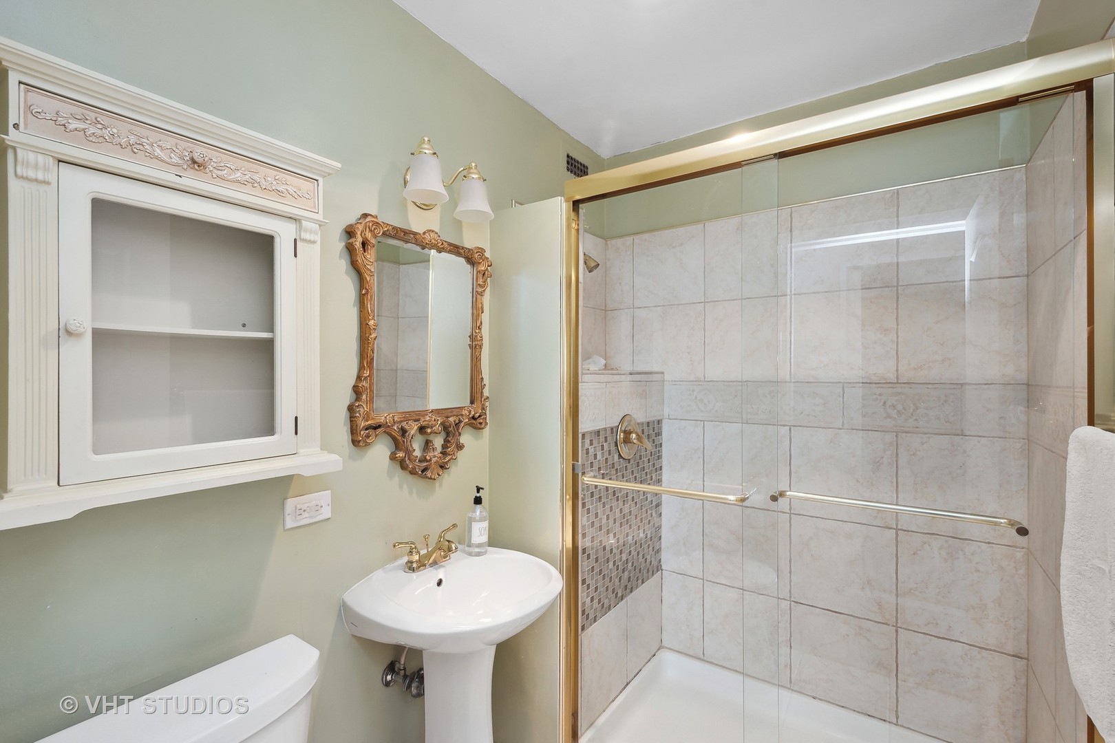 Undisclosed Address Chicago, IL 60610 - Photo 9 of 16 a bathroom with a sink shower and a mirror