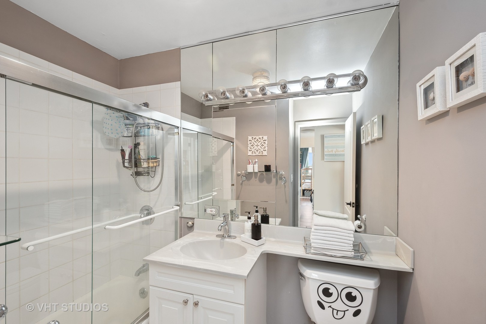 Undisclosed Address Chicago, IL 60610 - Photo 10 of 16 a bathroom with a sink a mirror and a shower