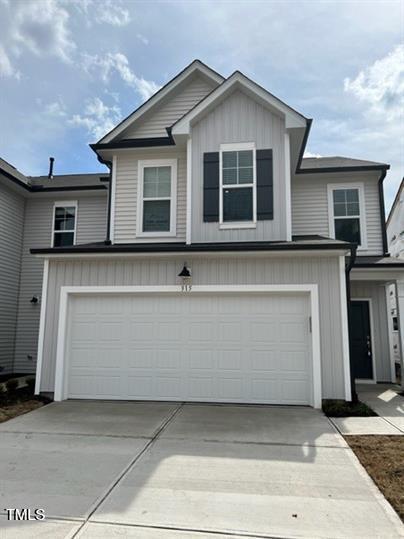 315 Villanova Drive Durham, NC 27713 - Photo 1 of 19 a front view of a house with a garage
