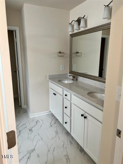 315 Villanova Drive Durham, NC 27713 - Photo 12 of 19 a bathroom with a granite countertop sink and a mirror