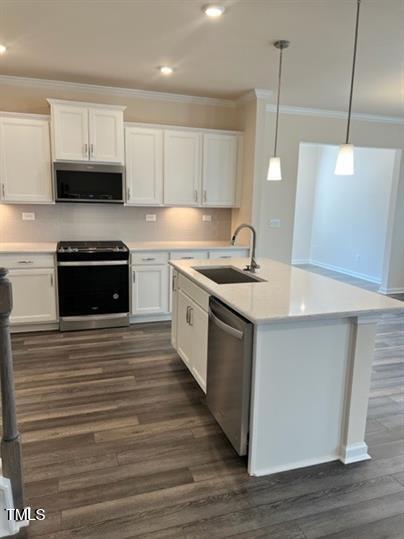 315 Villanova Drive Durham, NC 27713 - Photo 4 of 19 a kitchen with stainless steel appliances granite countertop a sink a stove and a wooden floors