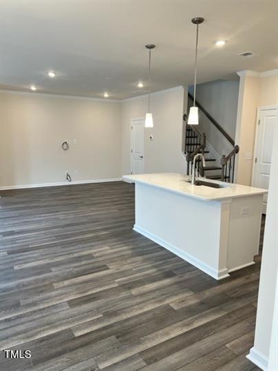 315 Villanova Drive Durham, NC 27713 - Photo 5 of 19 a view of an empty room with wooden floor and a sink
