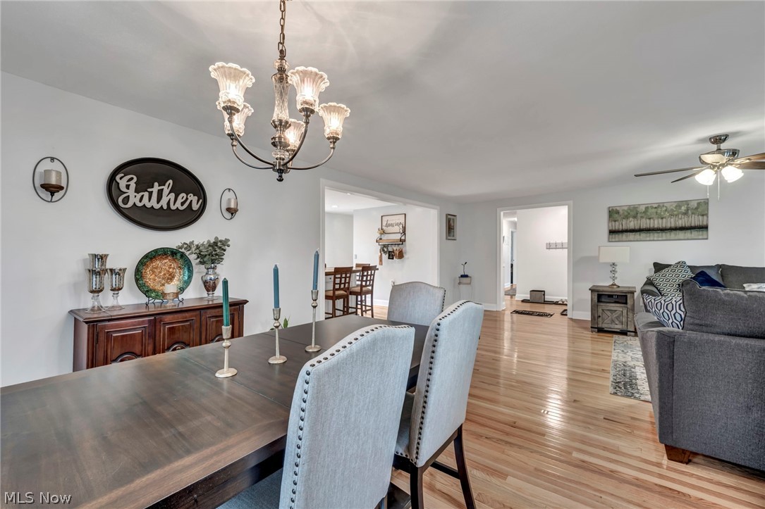 9753 Prospect Road Strongsville, OH 44149 - Photo 9 of 39 Dining area featuring light wood-style floors, a chandelier, and ceiling fan