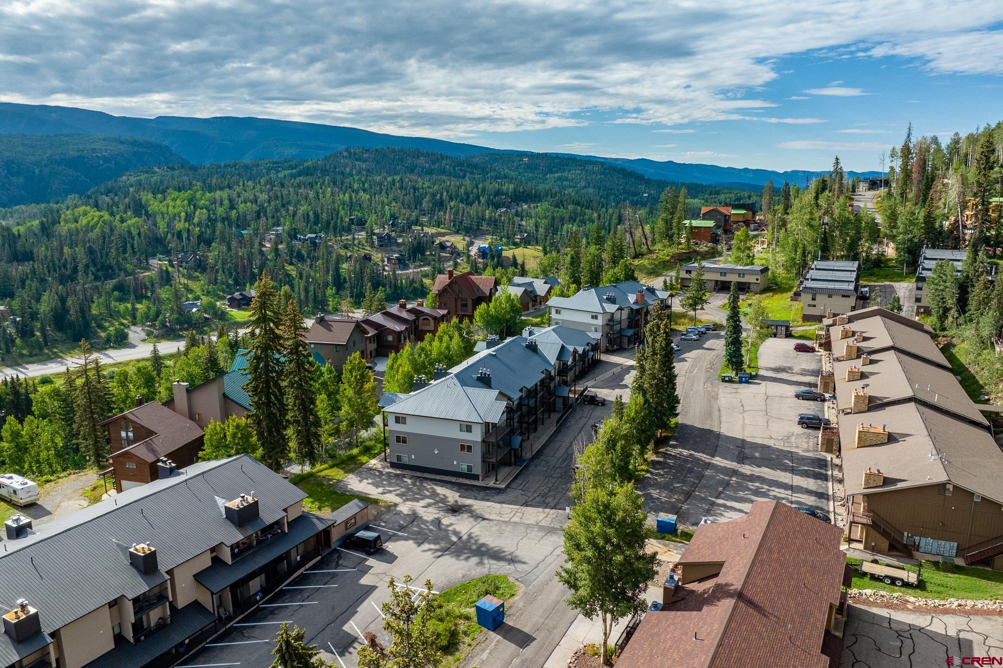 395 Sheol Street, Unit 37 Durango, CO 81301 - Photo 18 of 18 an aerial view of a city with lots of residential buildings and mountain view in back